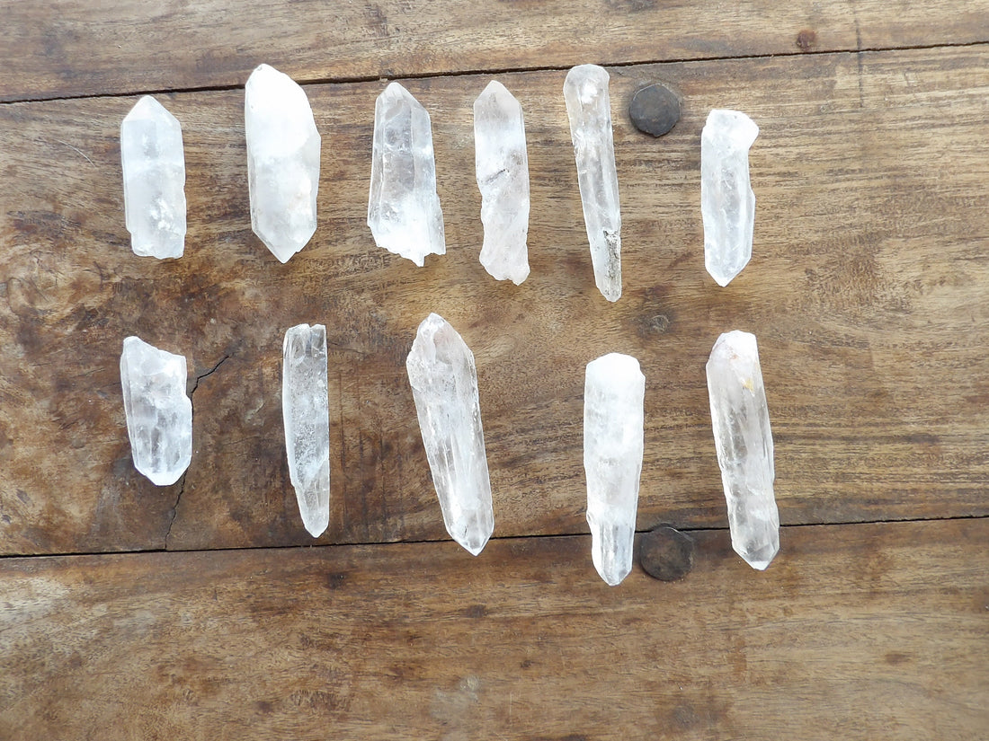 Crystal points arranged on a wooden surface