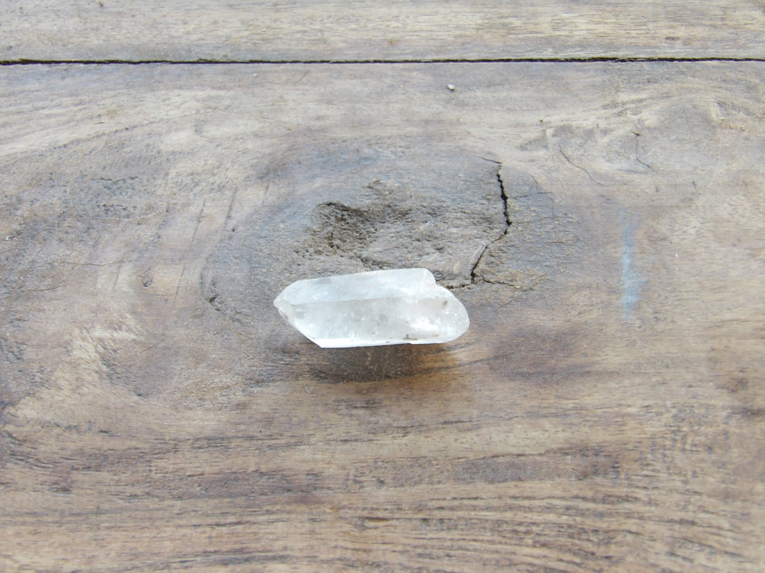 Clear crystal on a wooden surface