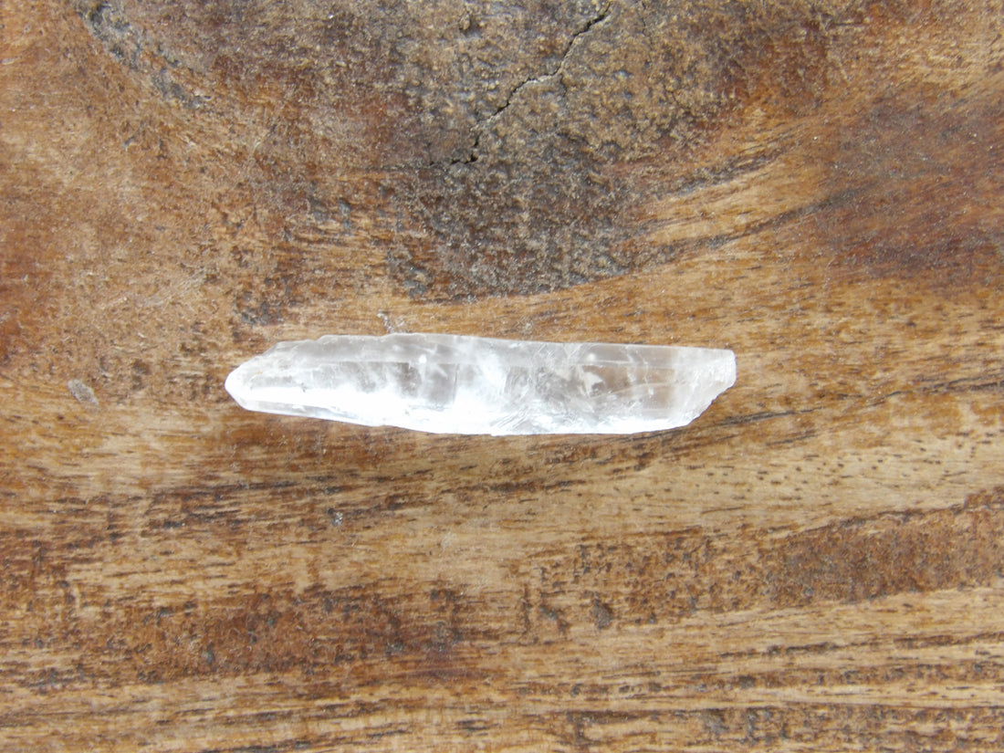 Tiny clear quartz crystal point natural raw stone