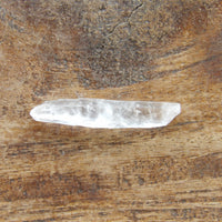 Tiny clear quartz crystal point natural raw stone