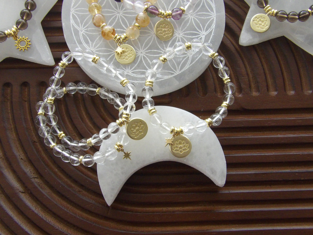 Clear quartz beaded bracelet with 18k gold-plated lotus charm, handmade exclusively for Star Woman Crystals.