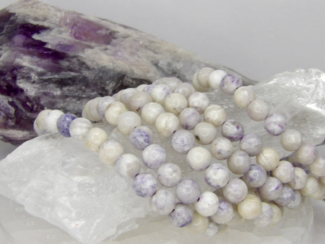 Natural 6mm Tiffany Stone bracelet featuring polished lavender, white, and gray marbled gemstone beads.
