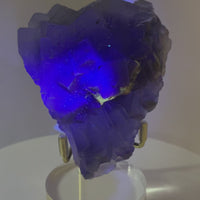 One-of-a-kind UV-reactive blue fluorite crystal from Pakistan with stacked cubic crystal formations and smoky blue-violet color.