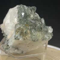 Natural Garden Quartz from Balochistan Pakistan with dense dark green and earthy mineral inclusions and abundant quartz crystal growth.