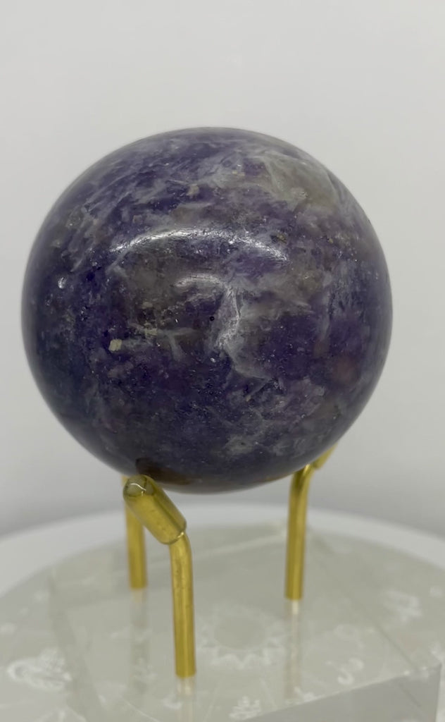 Natural Lepidolite sphere with soft lavender tones and natural mica shimmer. A polished 200-gram specimen from Star Woman Crystals.