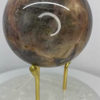 Natural Black Moonstone sphere with soft silver sheen and distinctive feldspar patterning. Polished 300-gram sphere from Star Woman Crystals.