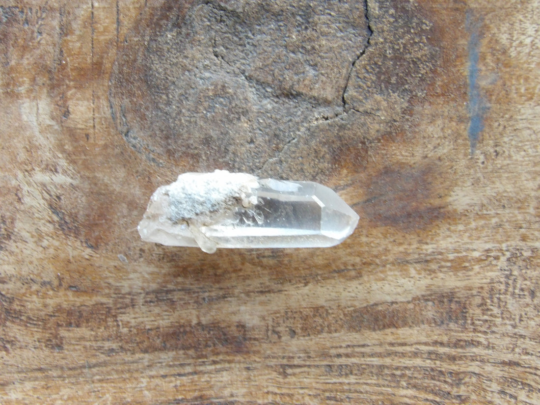 Clear quartz crystal point natural raw stone