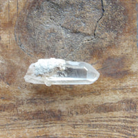 Clear quartz crystal point natural raw stone