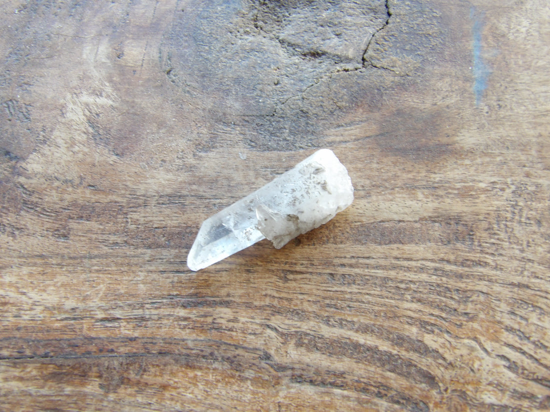 Clear quartz crystal point natural raw stone