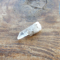 Clear quartz crystal point natural raw stone